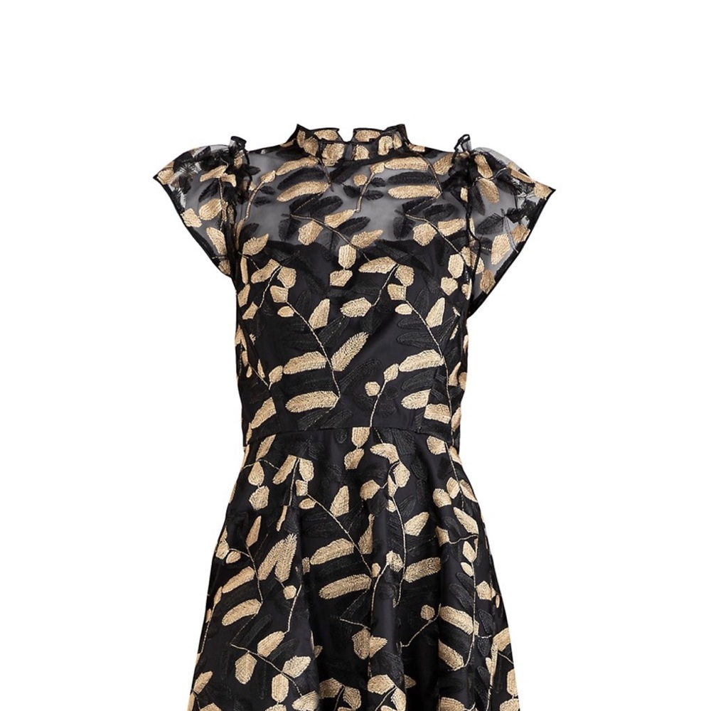 The Everlie dress from Shoshanna is skillfully crafted of embroidered lace.